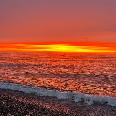 ✔️A crazy, fiery sunset is burning over the Black Sea. The water shimmers like liquid gold, softly lapping foam against the pebbles.