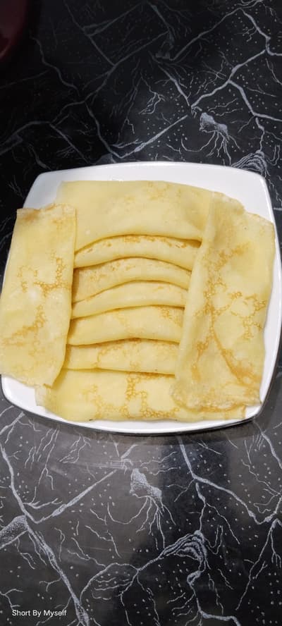 Patishapta is an extremely popular and traditional winter pitha (rice cake) or snack of Bengal. This delicious snack is prepared by making a thin batter of rice flour and all-purpose flour, frying it on a griddle like a crispy or soft flatbread, and wrapping it with a sweet filling inside.
