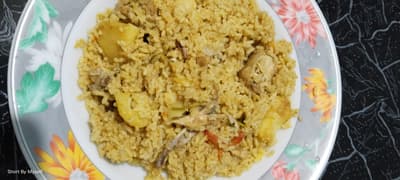 Biryani is a world-famous, aromatic South Asian dish celebrated for its rich flavors and royal heritage.
It features premium long-grain basmati rice layered with tender marinated meat and fragrant spices.
Slow-cooked using the traditional "dum" method, the ingredients simmer in their own steam to lock in deep flavor.
